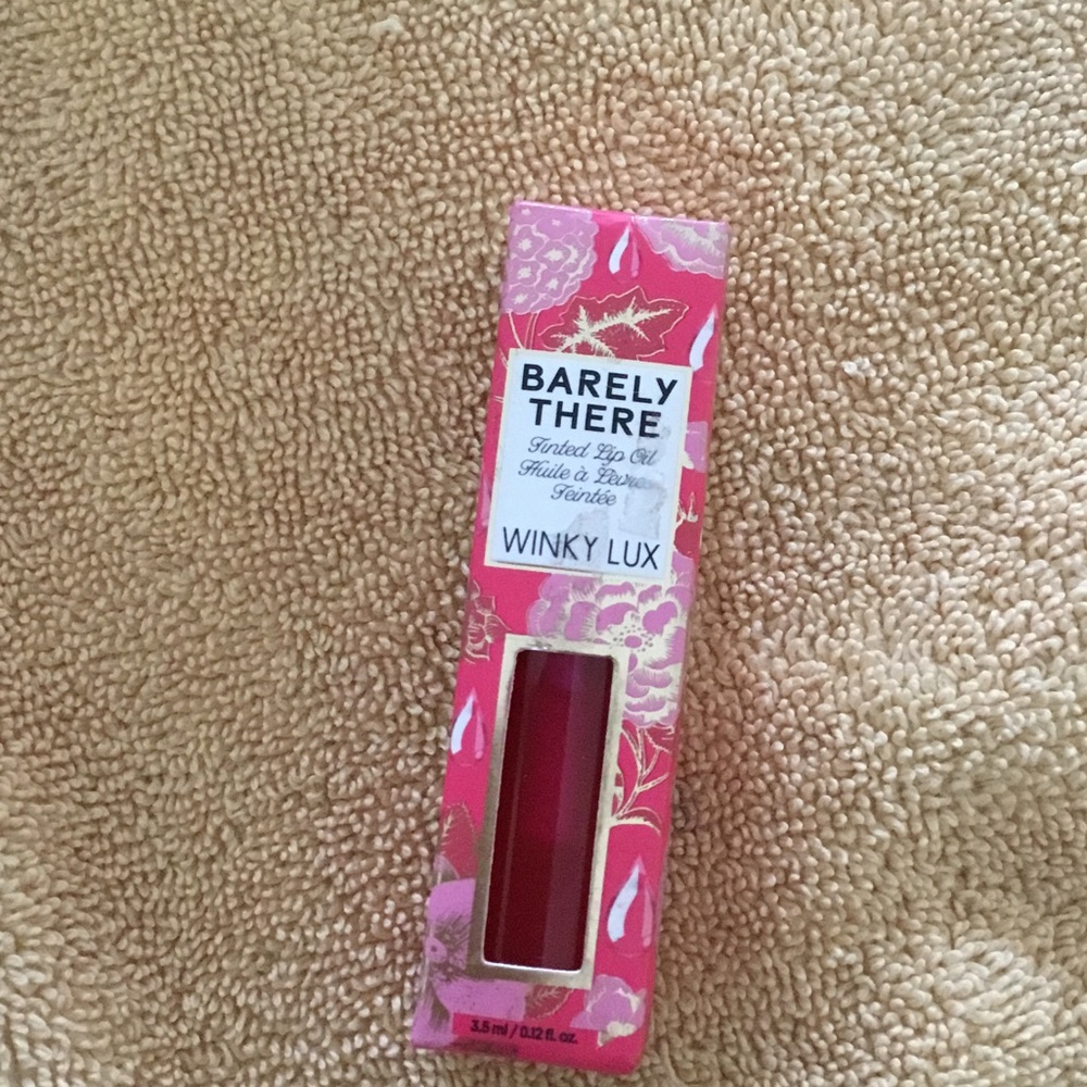 WINKY LUX Barely There Tinted Lip Oil - Bright Pink Packaging with Red Oil